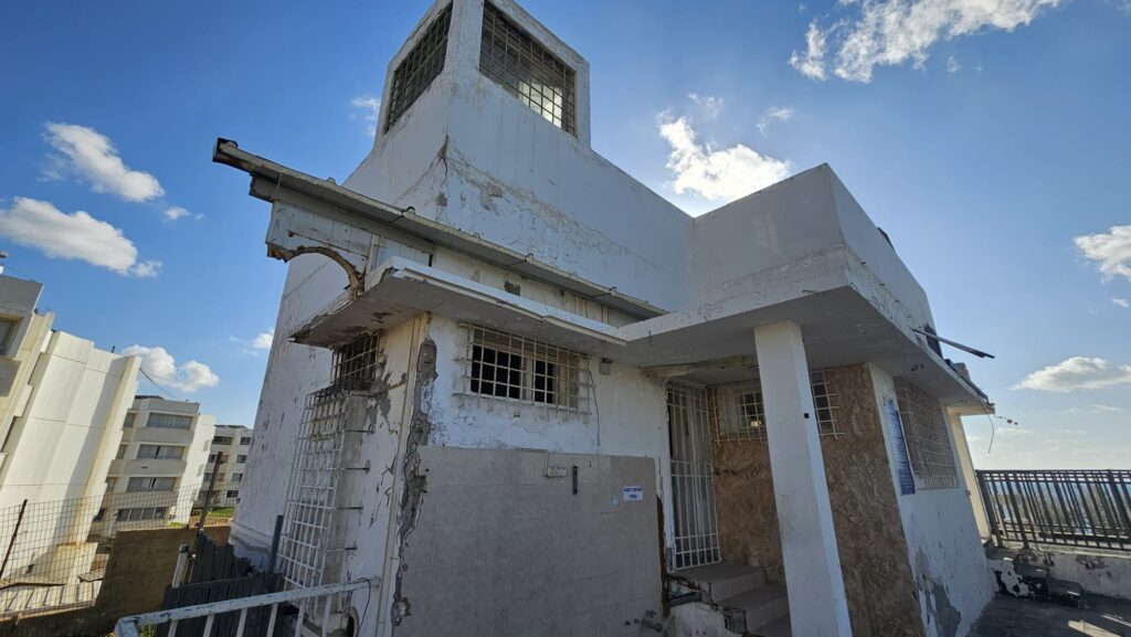 Another angle of the house. With what, might be a guarding post, on the roof of the house