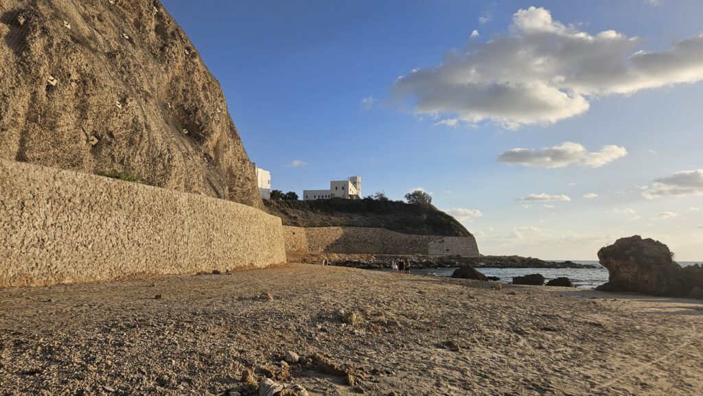 South to the house stands another old building.  In the early 1940s, a coastal warning station was established at this location by the British Coastal Police due to the threat posed by the German Nazi's navy. After the threat subsided following the Battle of El Alamein, the station remained to prevent illegal Jewish immigration.
The site was chosen for its strategic location on a kurkar (calcareous sandstone) cliff, which provided a wide observation range, and because the nearby southern beach had been used several times for clandestine immigration by the Mossad LeAliyah Bet.
Initially, the station consisted only of a searchlight, but later a radar was added, and the compound was surrounded by three barbed-wire fences. The adjacent northern station was located at Stella Maris, and the southern one near Ma’abarot Youth Village (“Na’orim”). Due to its role in obstructing immigration efforts, Palmach units set out twice to destroy the naval radar at the site. In late 1945, the radar station was bombed twice within 60 days. Today, a military radar installation operates at the site