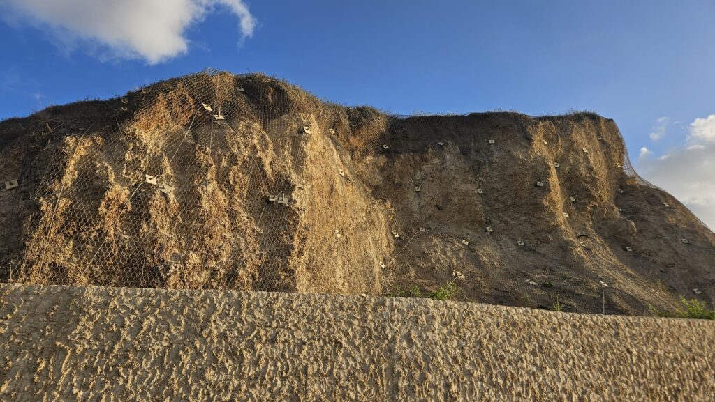 The Kurkar cliff is held with nets and soil nails