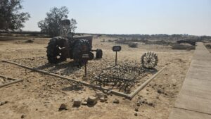 Some of Mizpe Revivim old agriculture equipment and among it the tractor that was brought here on the first day and a D-2.