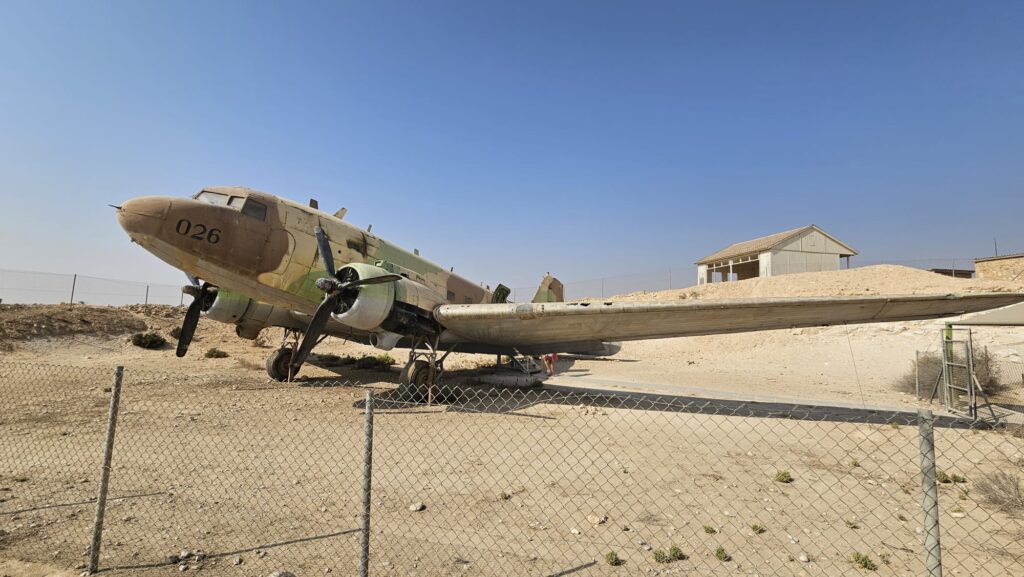 DAKOTA DC 3 - The twin engine supply plane was made by the Douglas Aircraft Company. During the war of independence, when access to the Negev was cut off by the Egyptian army which controlled the Ashkelon - Faluja line, the plane was used to fly in troops, evacuate the wounded and to bring in supplies. The plane was flown by foreign volunteers Michael Weimers, a member of Revivim, suggested building a landing strip for the Dakotas in the area east of the settlement. When the planes landed, the air strip was marked by burning paraffin soaked rags in tin cans (Goznikim). The loading and offloading was risky and had to be done quickly because the Egyptian army controlled the surrounding hills. The wounded received first aid in the field hospital at the cave, and were then air lifted out to hospitals across the country.
