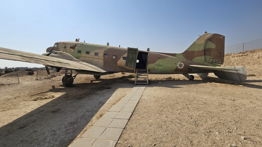 DAKOTA DC 3 - The twin engine supply plane was made by the Douglas Aircraft Company. During the war of independence, when access to the Negev was cut off by the Egyptian army which controlled the Ashkelon - Faluja line, the plane was used to fly in troops, evacuate the wounded and to bring in supplies. The plane was flown by foreign volunteers Michael Weimers, a member of Revivim, suggested building a landing strip for the Dakotas in the area east of the settlement. When the planes landed, the air strip was marked by burning paraffin soaked rags in tin cans (Goznikim). The loading and offloading was risky and had to be done quickly because the Egyptian army controlled the surrounding hills. The wounded received first aid in the field hospital at the cave, and were then air lifted out to hospitals across the country.