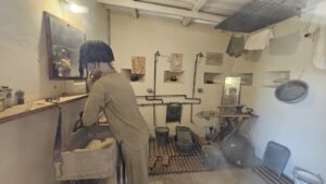 Public shower, from the early days of the place (if you push the button to the left of the door, you can hear him sings)