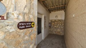 Public shower, from the early days of the place (if you push the button to the left of the door, you can hear him sings)