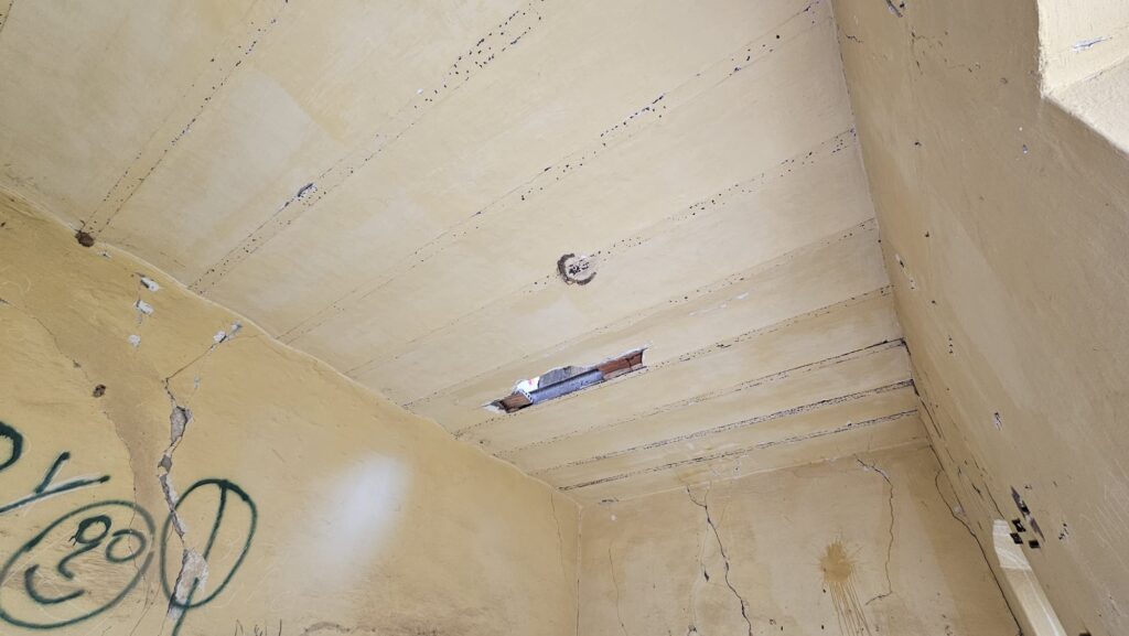 Here you can clearly see how the ceiling of this building were built - steel beam and masonry in between them.