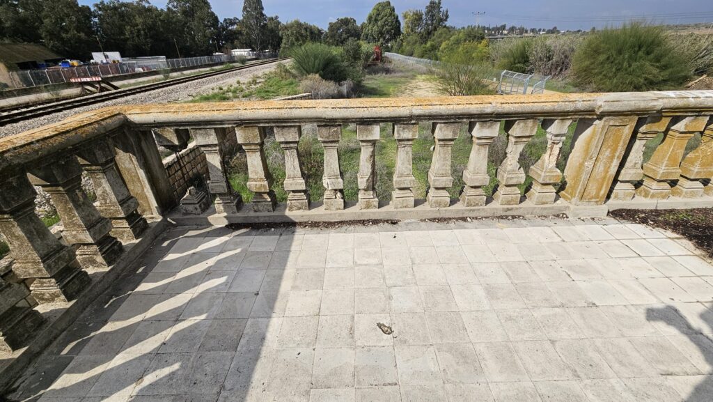 The balcony to the west, it seems to be something hidden between the trees