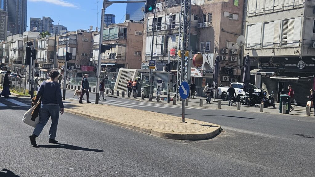 Israeli citizens running to Bialik underground Light Rail station to take cover when a siren alert was heard