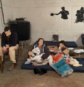 Exhausted shelter warriors in a public shelter after a hard night of siren alerts.