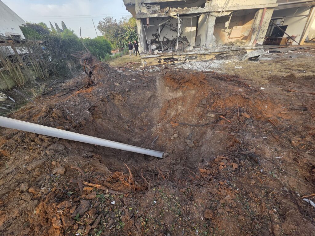 A building damaged by a missile from Lebanon tonight