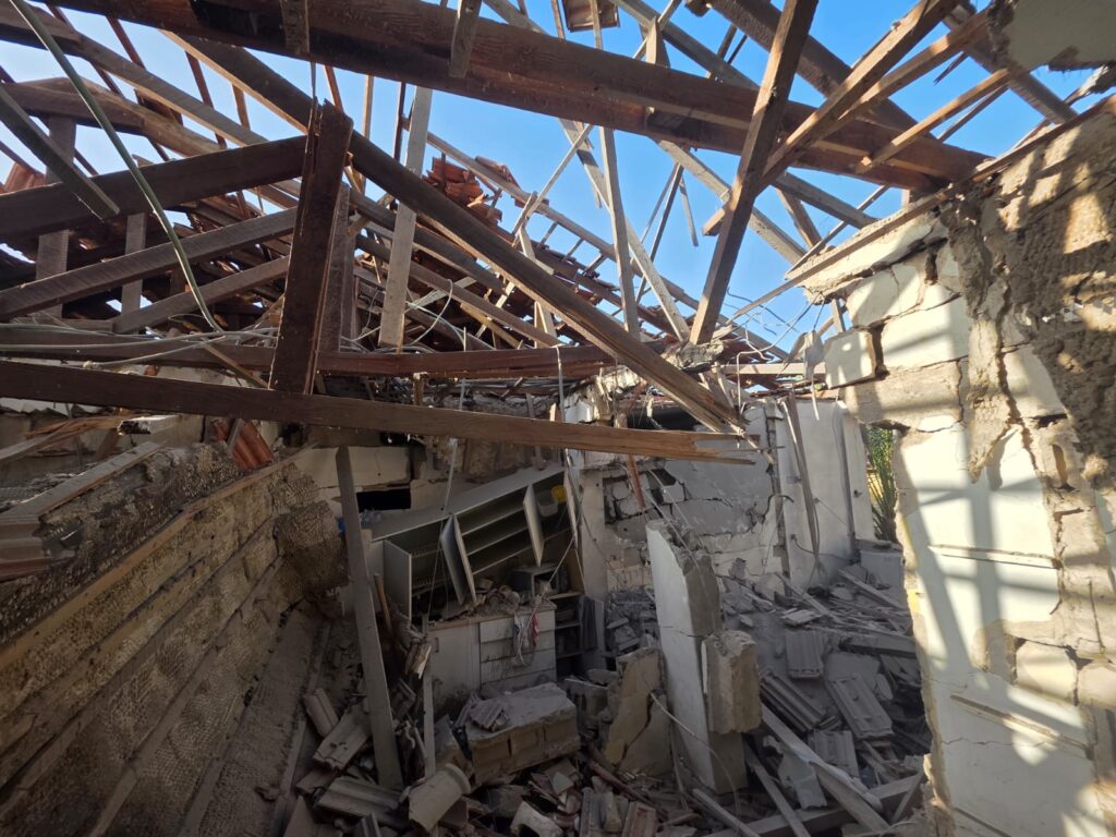 The damage from a cluster bomb that fell that morning - missile range