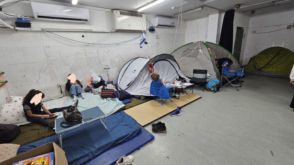 Our school shelter full of families who just set camping tents for a bit of privacy