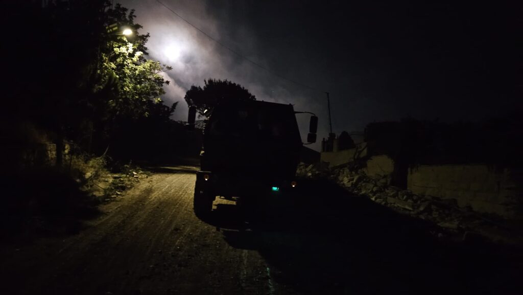 Driving the roads of south Lebanon with trucks and Hummers requires night-vision devices 