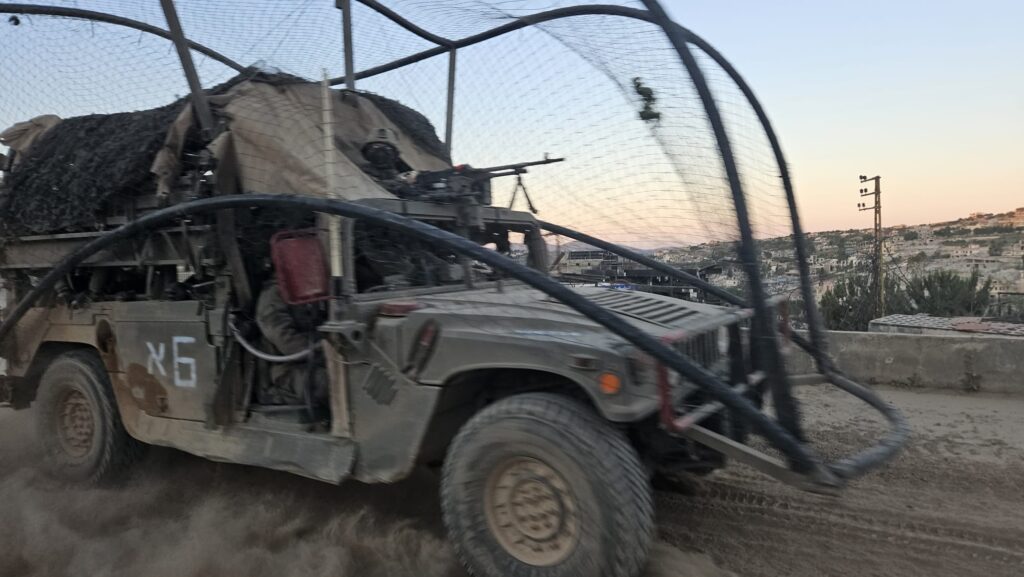 An improvised solution of nets on an IDF Humvee on its way across the border to defend the soldiers against the fiber optic drones.