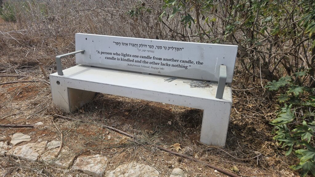 Along the less nice side of the hill, spread benches with quotes from the Talmud