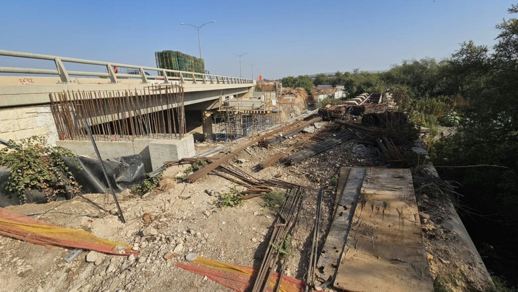 The bridge from above, used as storage for Road 6 extension works