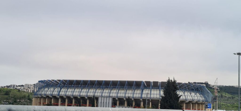 On top of Teddy stadium in Jerusalem (Source for left picture: Wikipedia.org) - solar panels